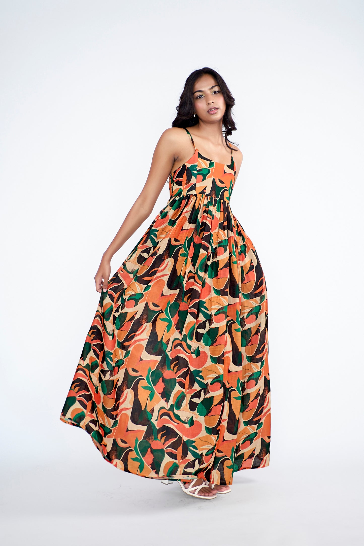 A flowy full-length spaghetti strap maxi dress