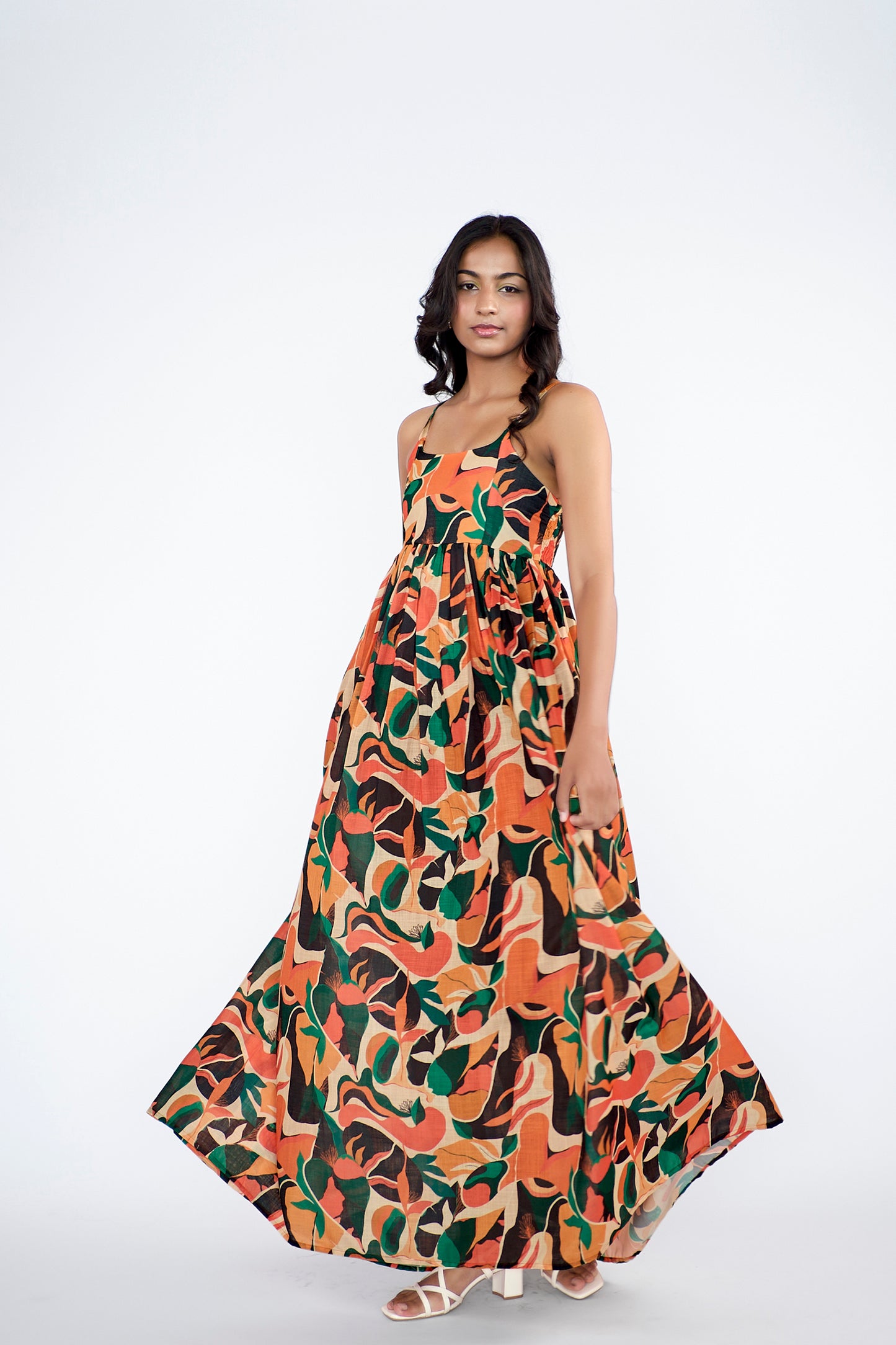 A flowy full-length spaghetti strap maxi dress