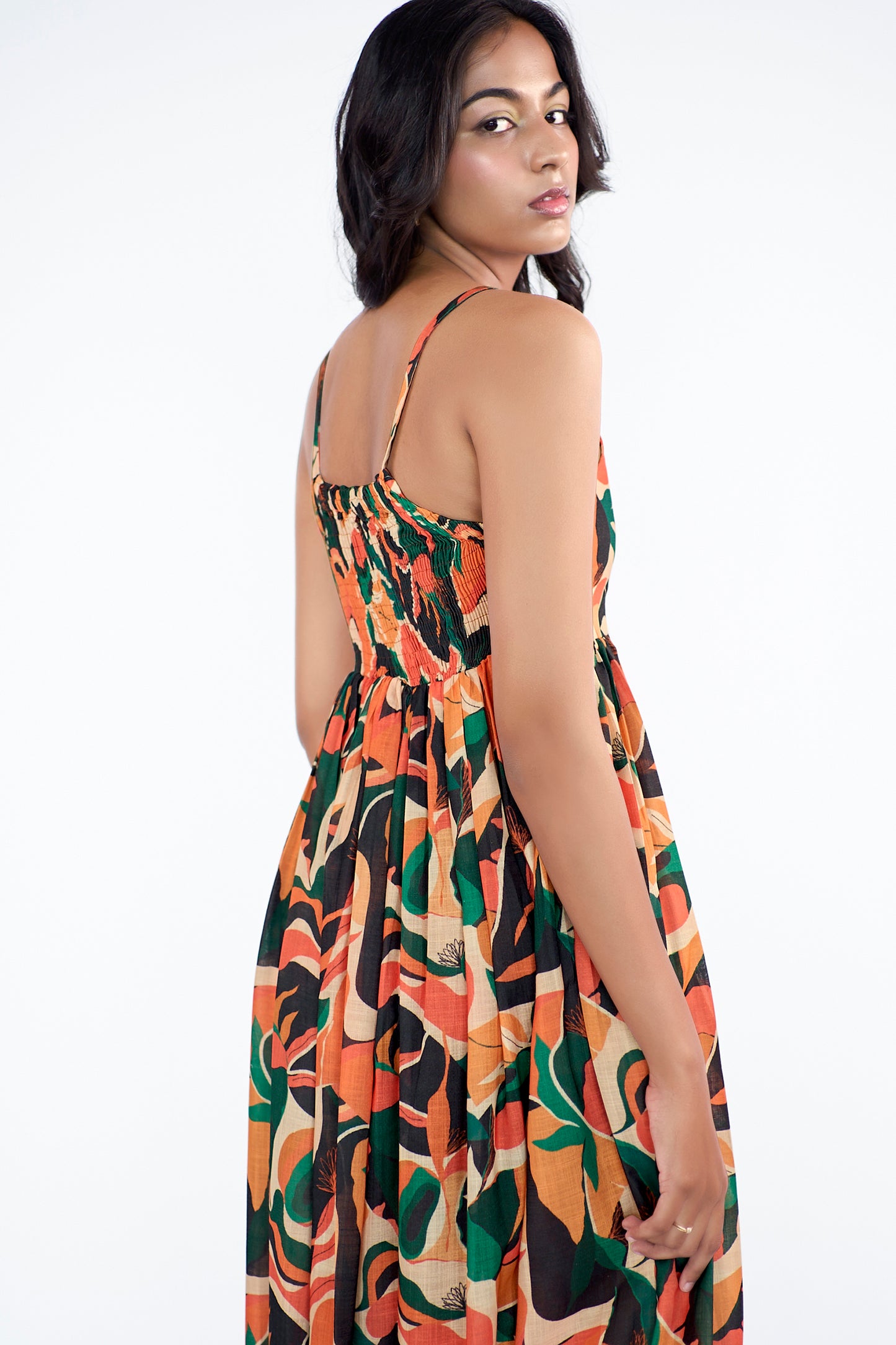 A flowy full-length spaghetti strap maxi dress