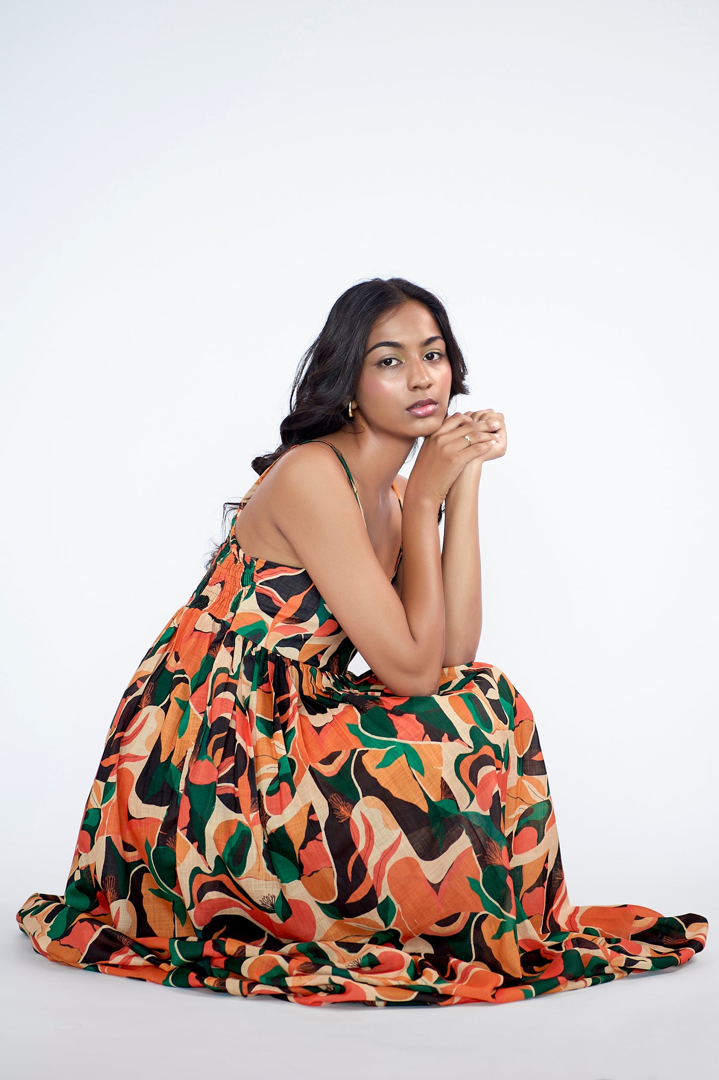 A flowy full-length spaghetti strap maxi dress