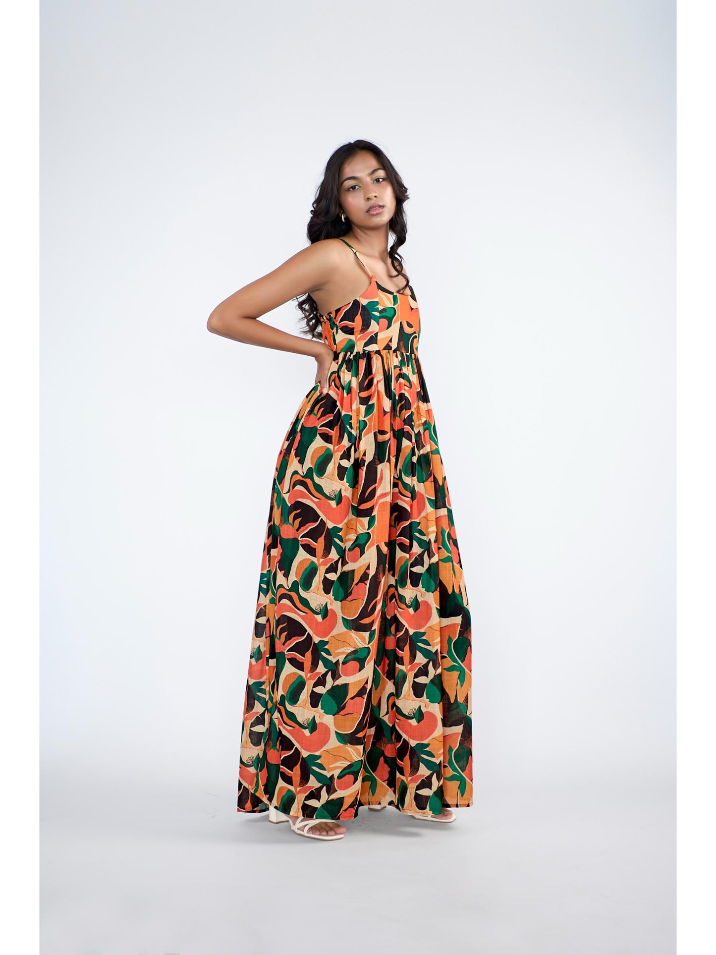 A flowy full-length spaghetti strap maxi dress