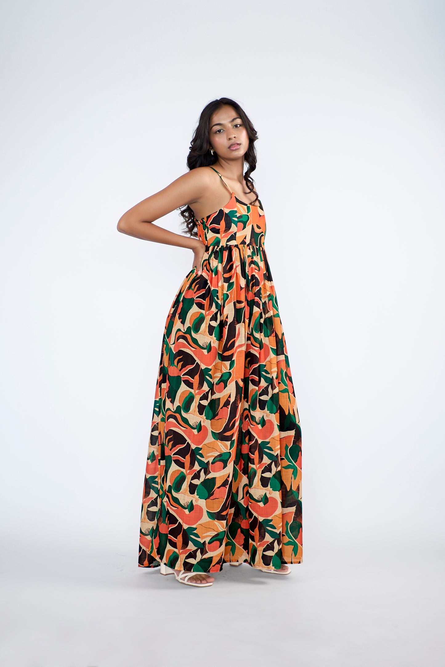 A flowy full-length spaghetti strap maxi dress