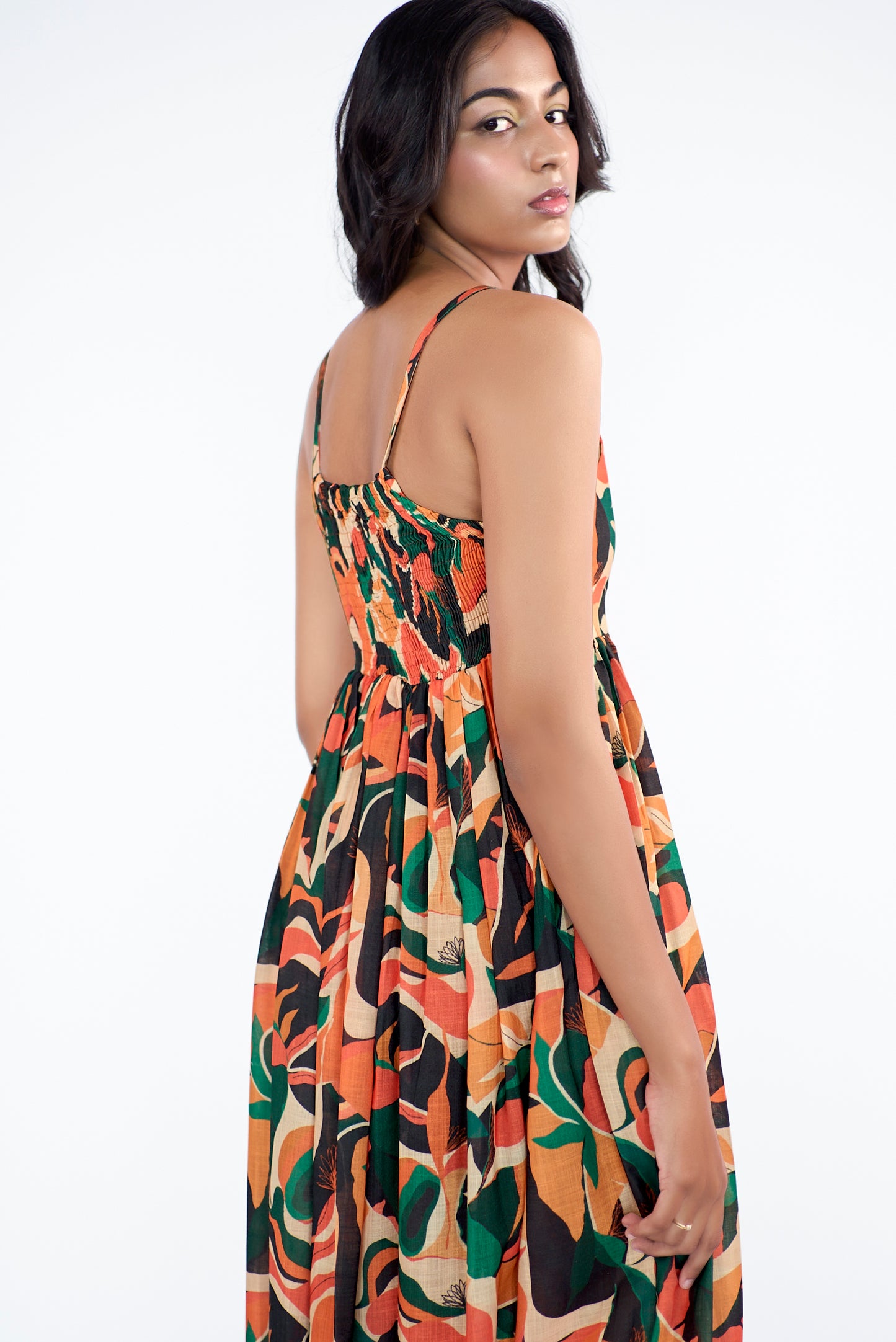 A flowy full-length spaghetti strap maxi dress