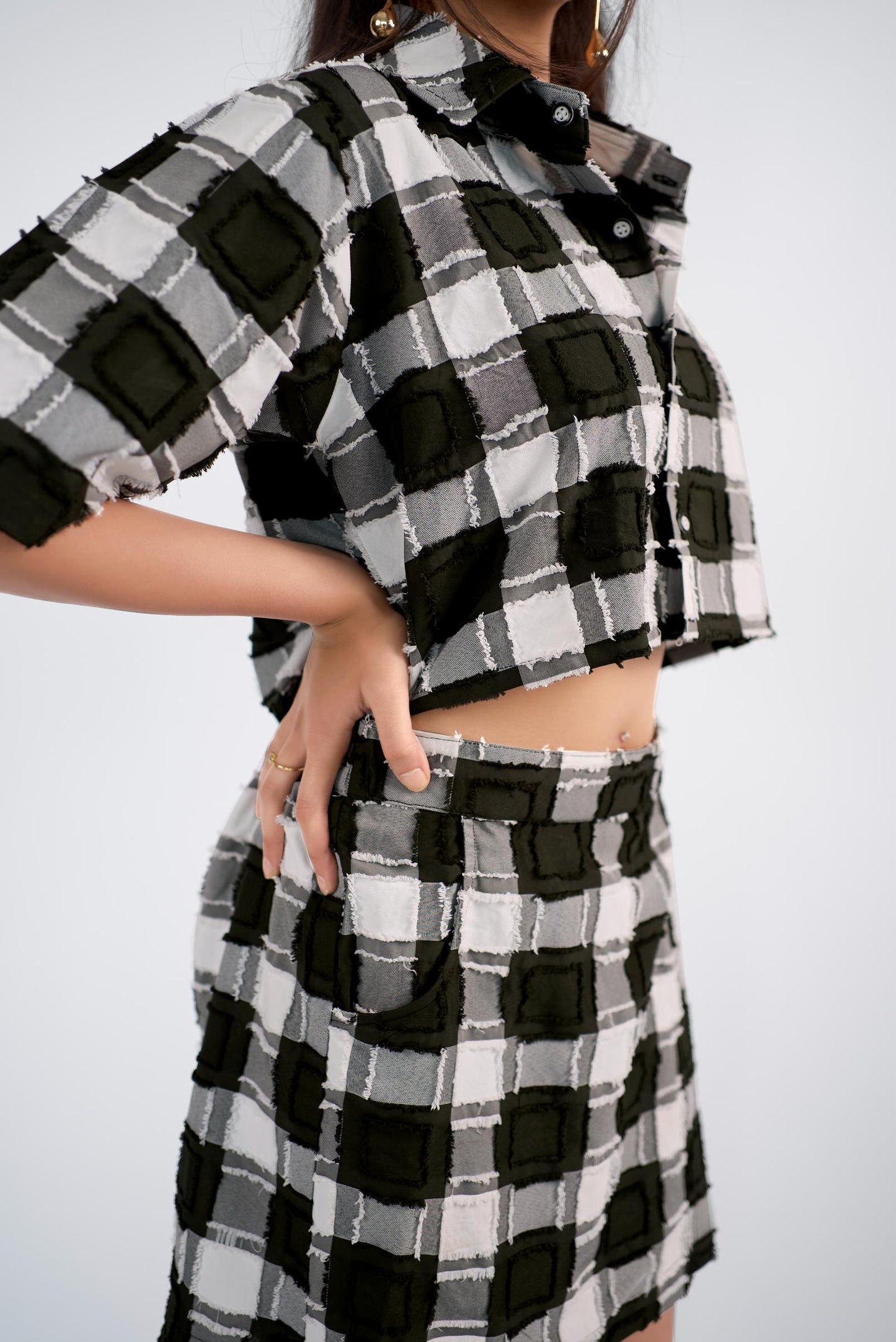 Checker-ed boxy-fit crop shirt paired with a skort