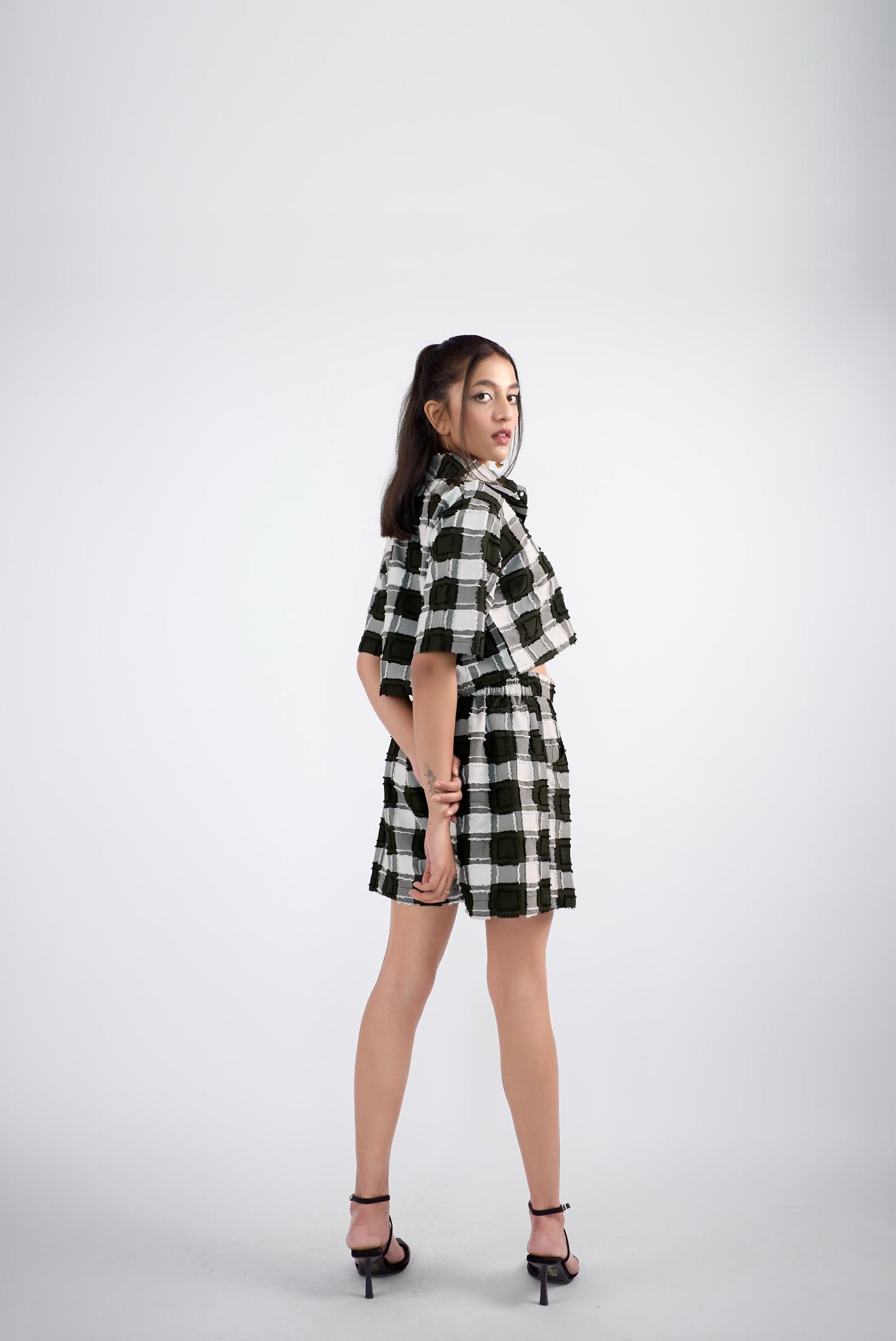 Checker-ed boxy-fit crop shirt paired with a skort