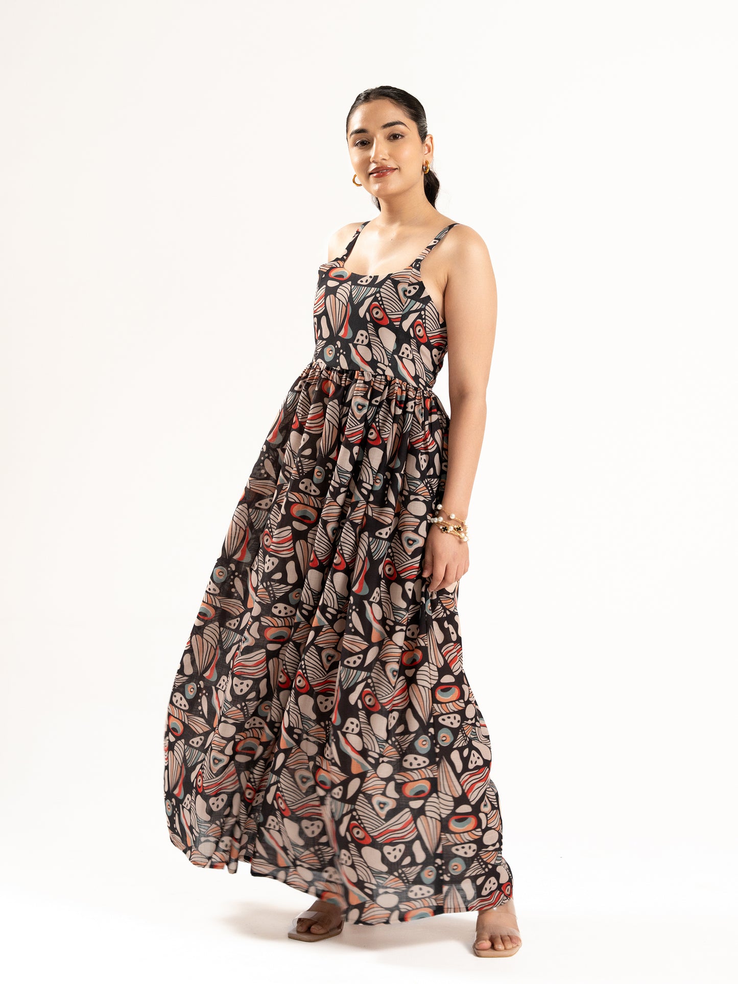 A flowy full-length spaghetti strap maxi dress