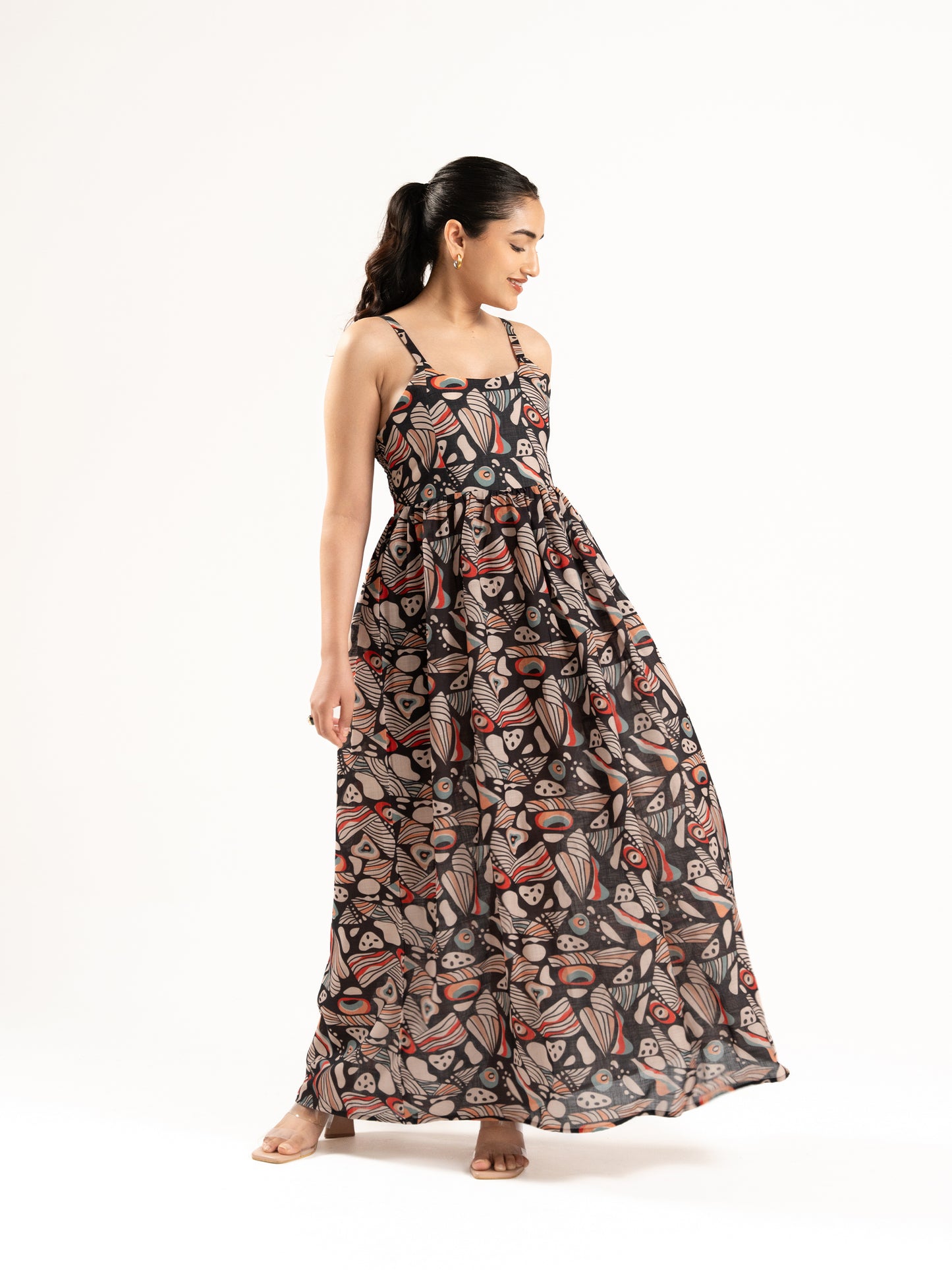 A flowy full-length spaghetti strap maxi dress