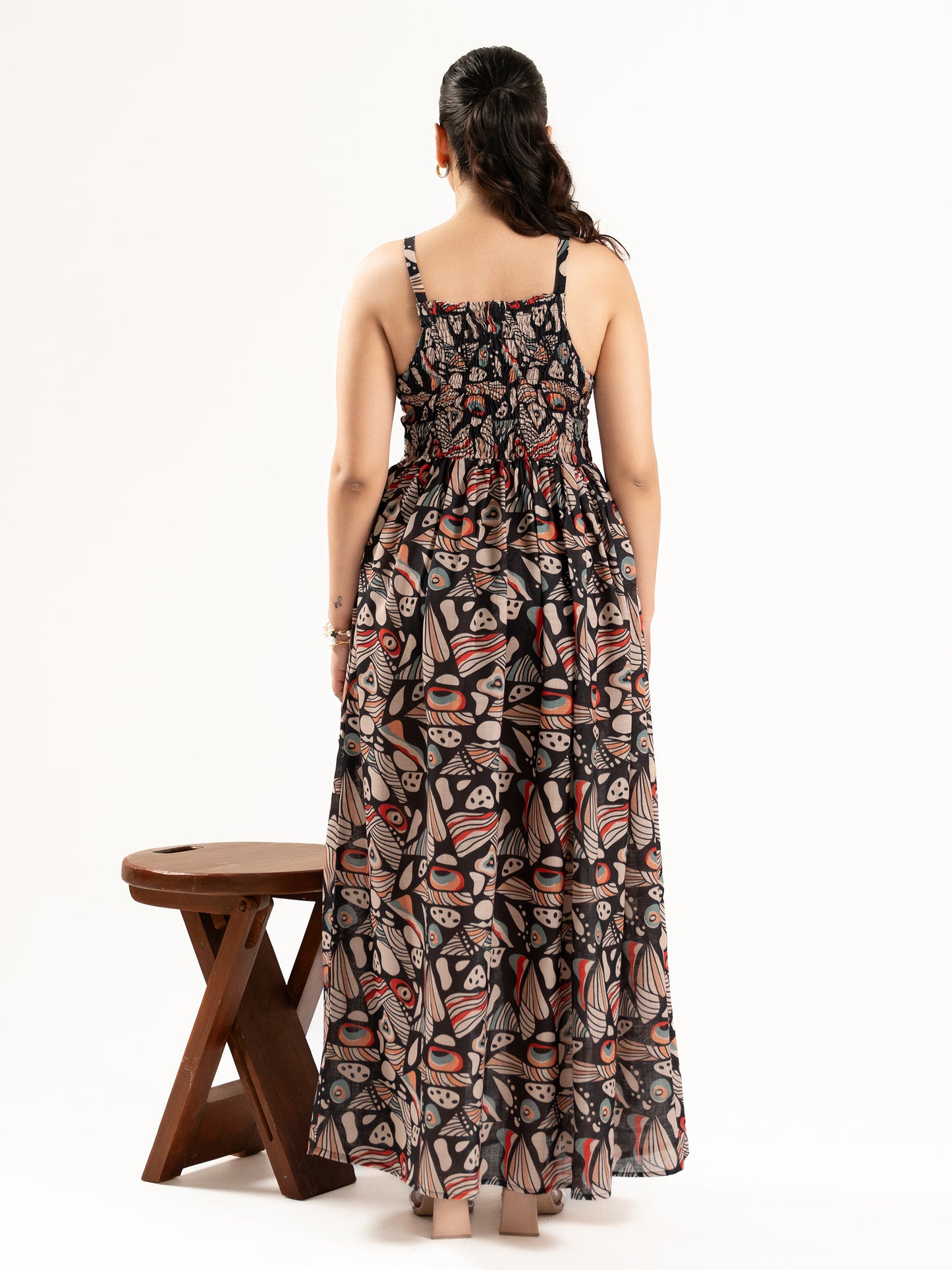 A flowy full-length spaghetti strap maxi dress