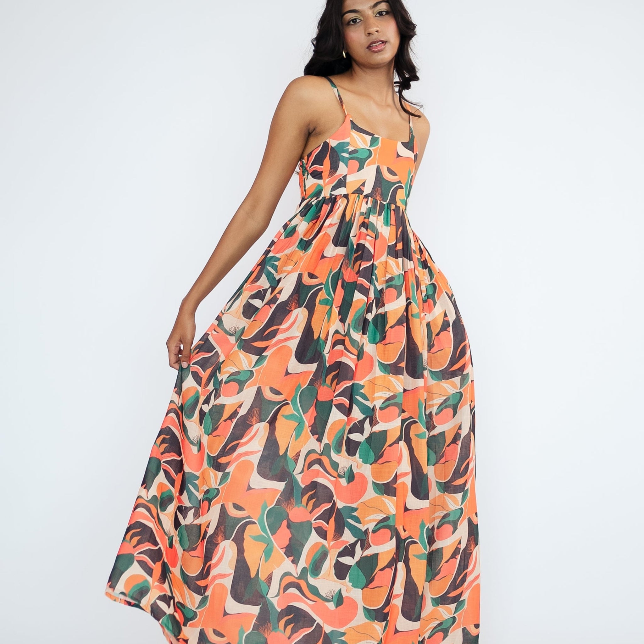 A flowy full-length spaghetti strap maxi dress