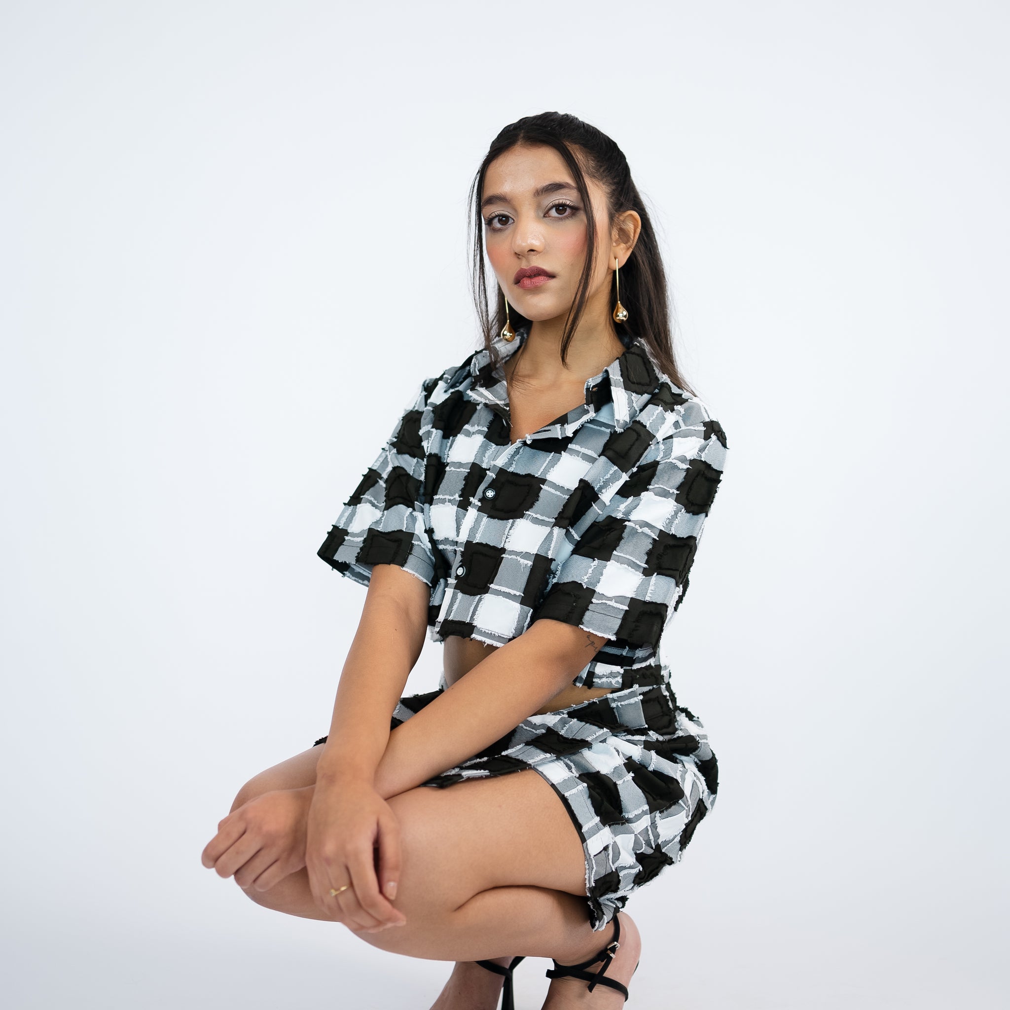 Checker-ed boxy-fit crop shirt paired with a skort